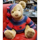 A large Harrods jointed bear, woollen hat and jumper, 75cm high