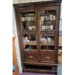 A 20th century oak display cabinet, carved glazed doors, barley twist legs, 183cm high, 106cm