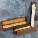 A slide rule;  set of rulers;  brass drawing instruments;  etc