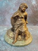 A late Victorian bronze matchstick/spill holder in the form of a young girl sat before a wicker