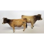 A Beswick Jersey bull, CH Dunsley Coyboy, printed marl; a Jersey cow, CH Newton Tinkle (2)