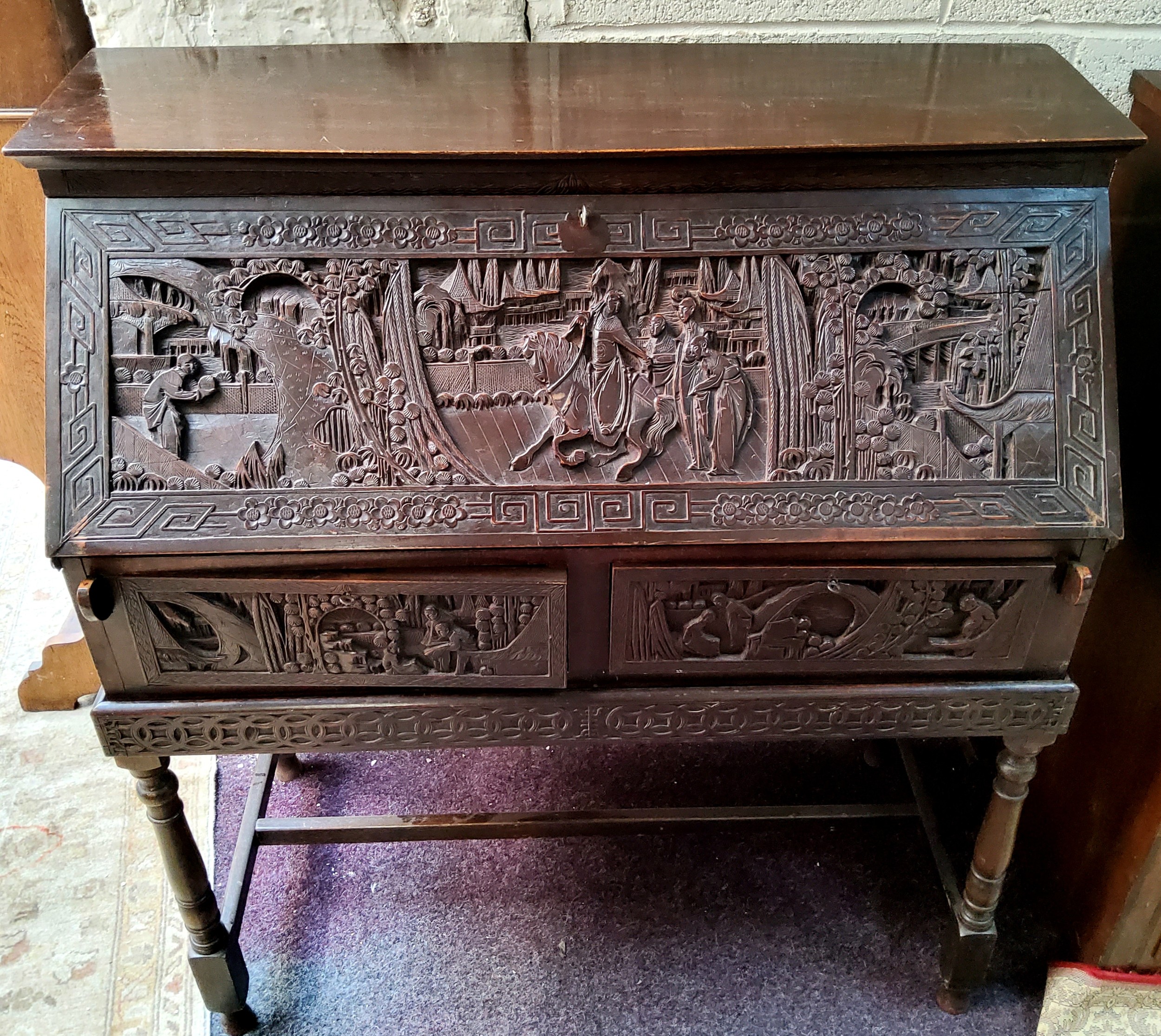 A late 19th / early 20th century carved padouk wood scholar's bureau on stand, profusely carved with - Image 3 of 3
