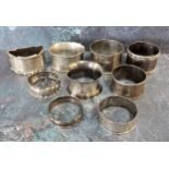 Late Victorian and later silver napkin rings, 192g (8)
