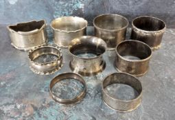 Late Victorian and later silver napkin rings, 192g (8)