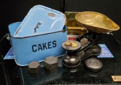 An early 20th century enamel Cakes tin and cover, c.1910; a set of cast iron & weights scales and