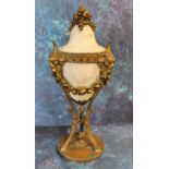 A 19th century gilt bronze and marble pedestal urn, the stand cast with rams' masks and fruit swags,
