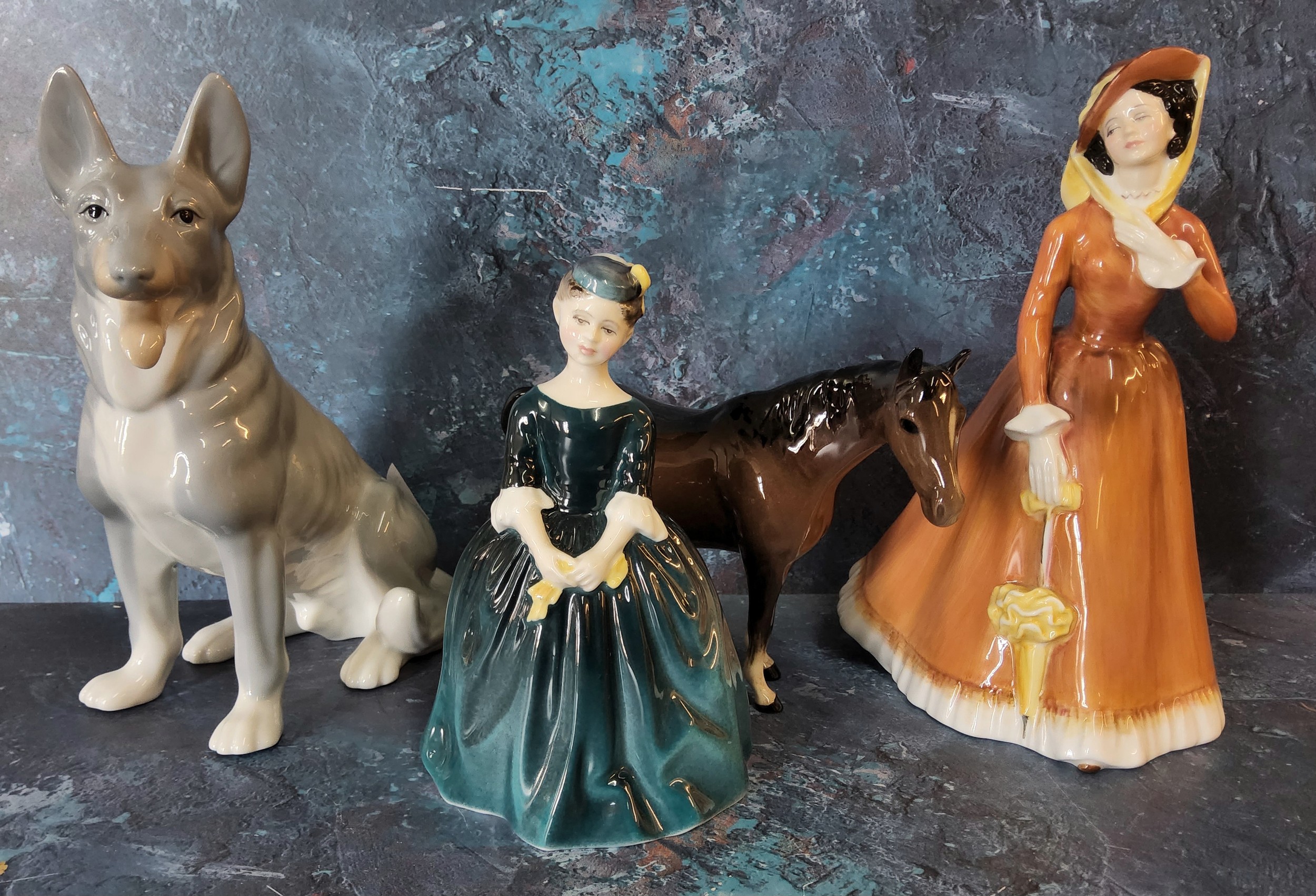 A Beswick bay mare;   a Royal Doulton lady, Julia, HN2705; another, Cherie, HN2341;  a John