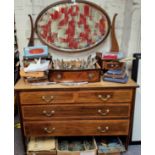 An Edwardian mahogany dressing table, oval mirror, above two short and two long drawers, tapering