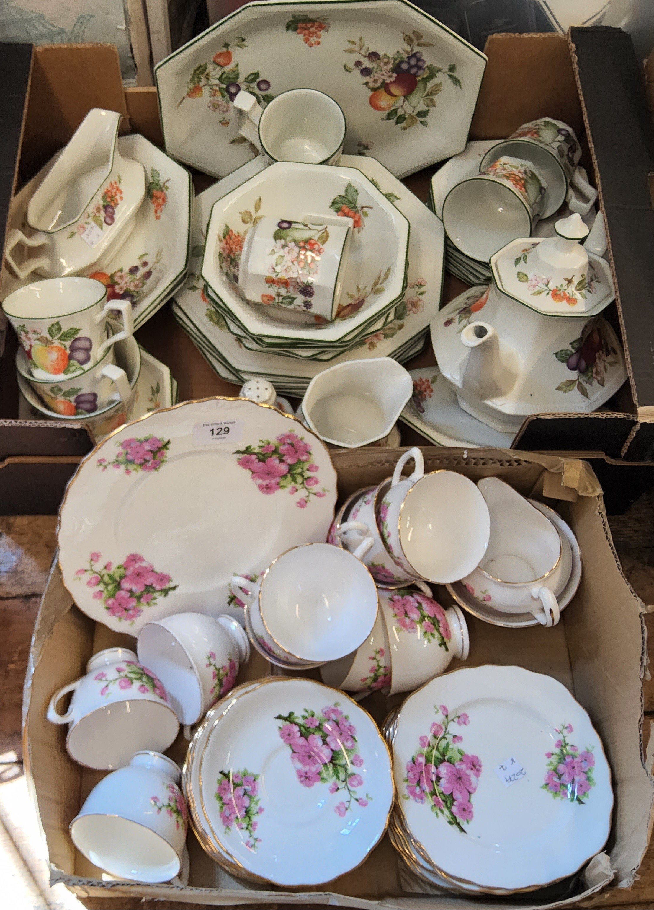 An English bone china tea service, for six, printed with pink blossom, gilt line borders;  a