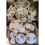 An English bone china tea service, for six, printed with pink blossom, gilt line borders;  a