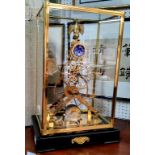 A modern brass skeleton clock, eagle finial, Roman numerals, fusee movement, glazed rectangular