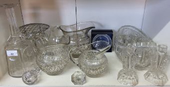 An early 20th century graduated set of three moulded jugs, 17 - 13cm high;  a Victorian clear