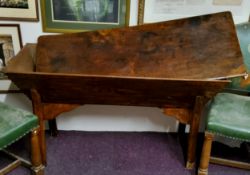 An early 19th century elm and fruitwood dough bin, rounded rectangular top, chipped carved edges,