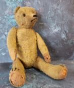 An early 20th century jointed mohair bear, horizontal stitched snout, button eyes, 42cm high, c.1910