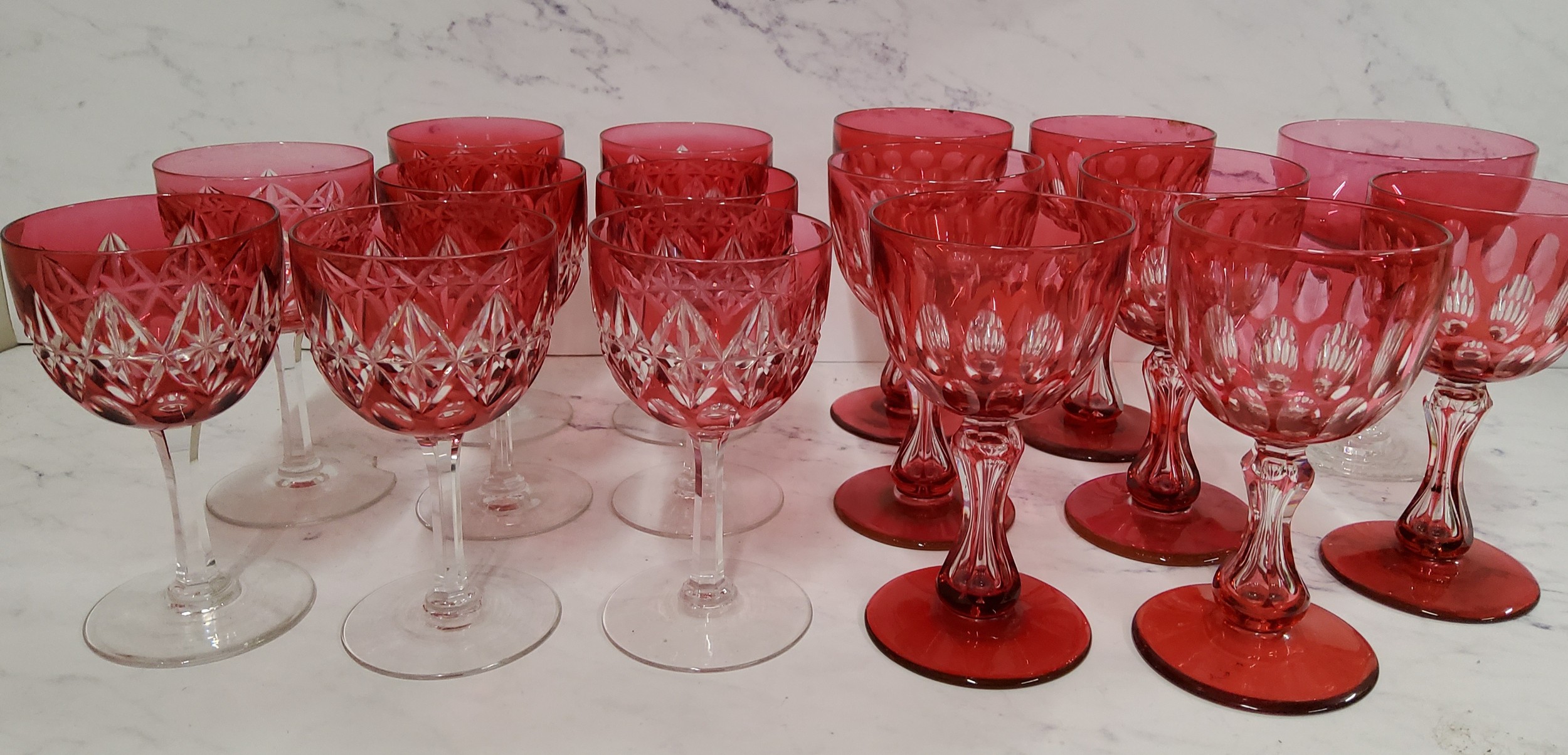 A set of seven ruby glass overlaid wine glasses, waisted columns, spreading circular bases, 12. - Image 2 of 2