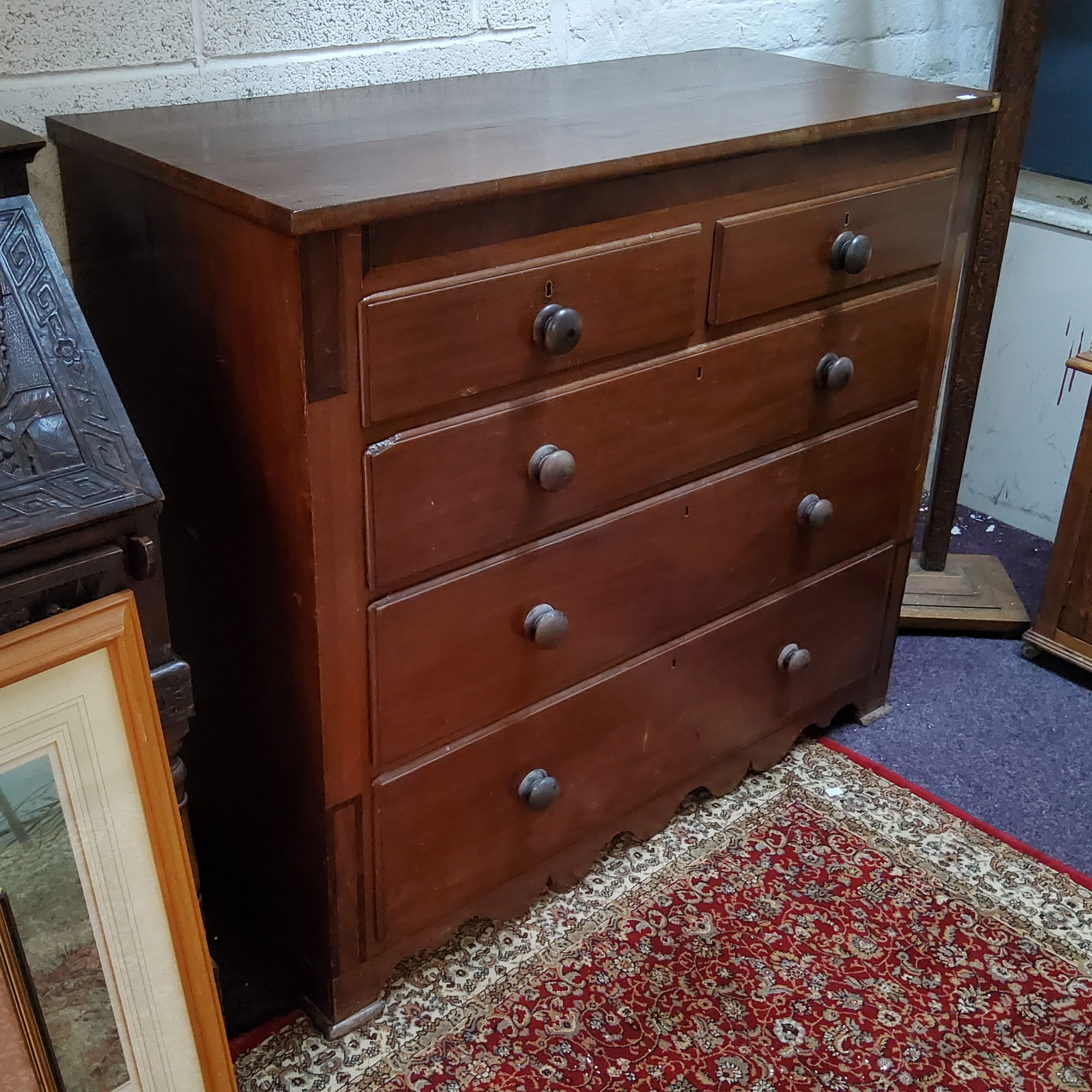 A 19th century mahogany chest, of two short and three long drawers, turned handles, 108cm high,