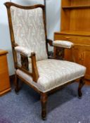 An early 20th century mahognay salon armchair, shaped back, stuffed back and seat, shaped legs, c.