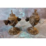 A pair of Regency bronze pastille burners and covers, of pedestal form, butterfly handles, the bases