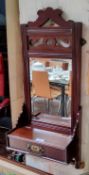 An Edwardian mahogany wall hanging dressing mirror, with drawer above towel rail, 80cm high, 40cm