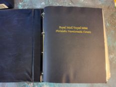Coins & Stamps - A Royal Mail/Royal Mint Philatelic Numismatic covers album complete with slip case,