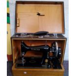 A Singer sewing machine, cased