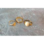 A 9ct gold band, size S; two 9ct gold signet rings, cut; 6.65g total