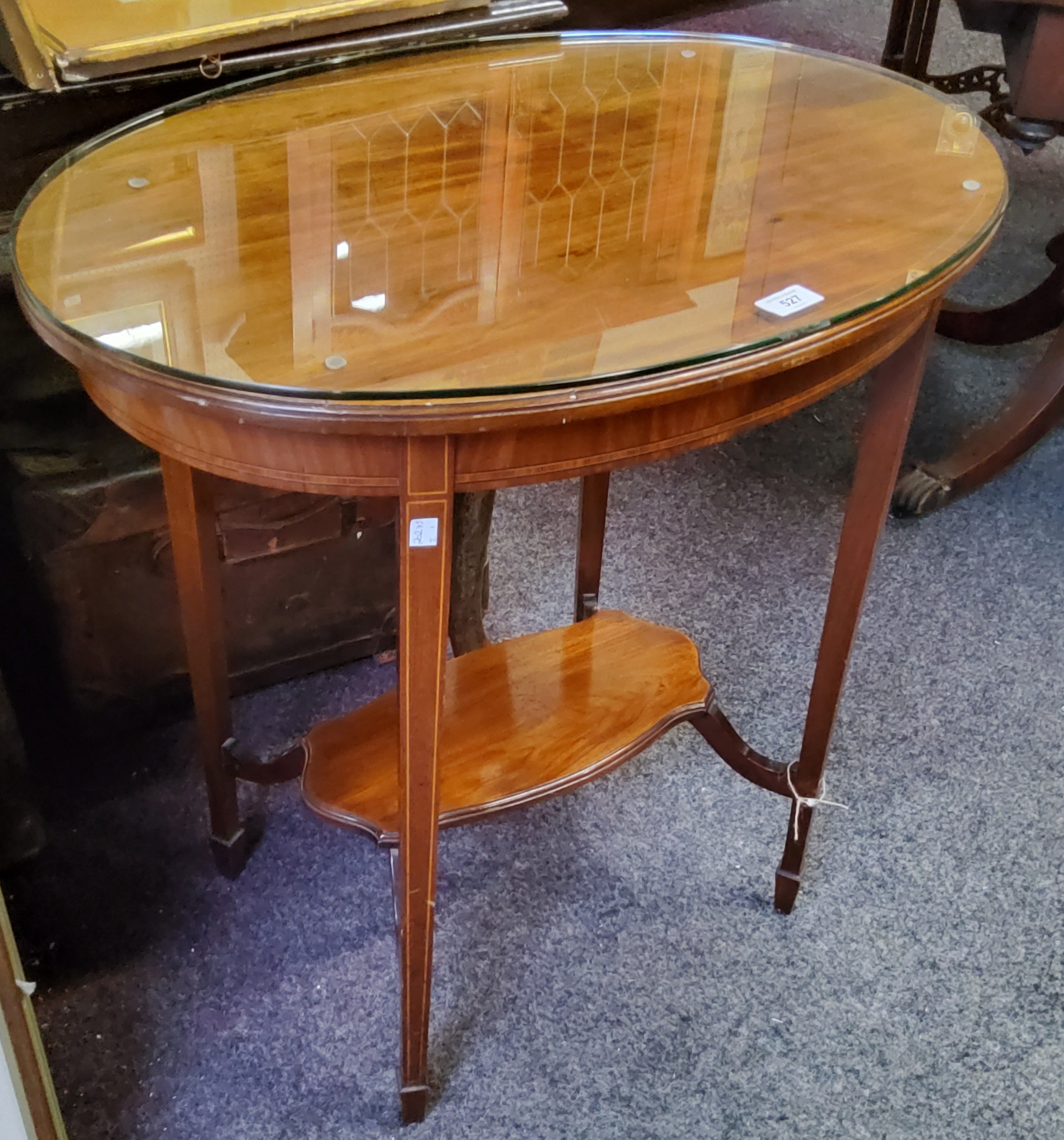 An Edwardian oval mahogany occasional table, satinwood strung, tapered square legs, 70cm high,