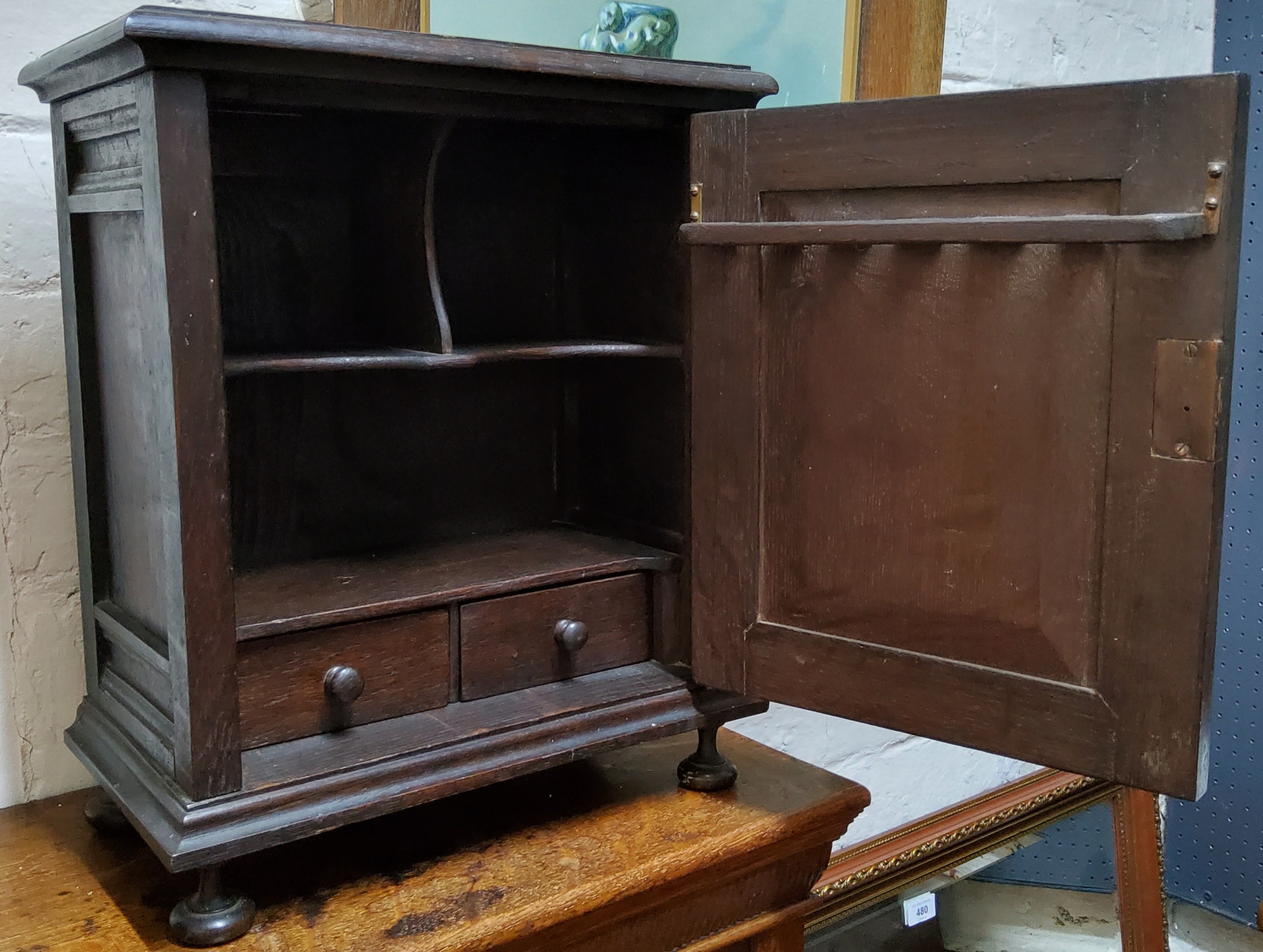 An early 20th century oak table top, smokers cabinet, carved ;lozenge panelled door, fitted - Image 3 of 3