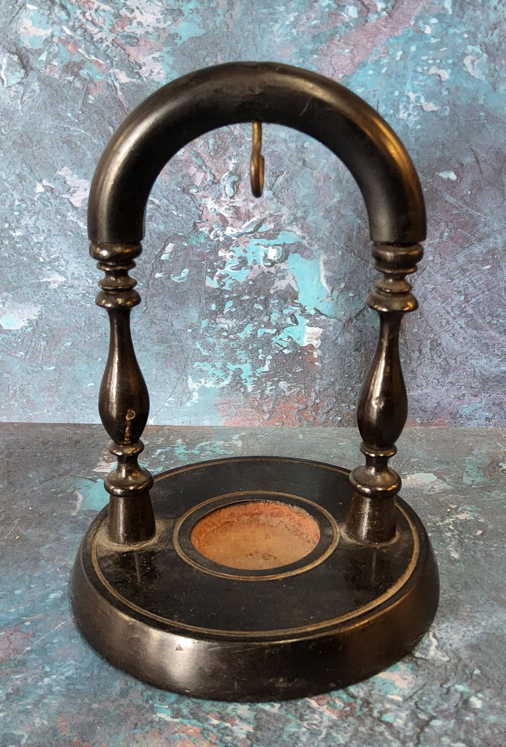 A Victorian ebonised pocket watch stand, the circular base with label From California House