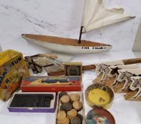 A Triangtois wooden hobby horse; HMS Pinafore pond yacht; various domino sets; a Magico Rub it game;