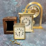A silverplated brass travel clock, french movement, white enamel dial black Roman numerals, Williams