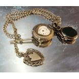 A continental silver lady's open faced fob watch, unusual heart shaped dial aperture, import