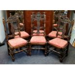 A set of six oak dining chairs, in Cromwellian style,  the cresting rail carved with masks and