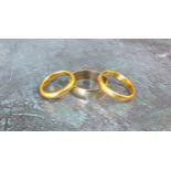 Two high carat wedding bands, unmarked, tested as gold 8.9g gross weight