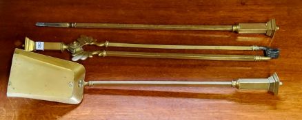 A set of three brass fireside implements and andiron, 70cm long (4)