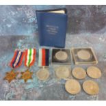 A WWII 1939-1945 star with ribbon; another Italy Star with ribbon; a WWII Service medal with ribbon;
