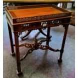 A reproduction mahogany silver table, pierced gallery, triple cluster legs, pierced X stretcher,