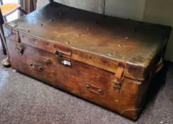 An early 20th century leather trunk, handles to sides, lift out tray, 85cm long, 33cm high, 48cm