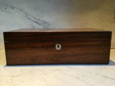 A Victorian rectangular rosewood writing box, mother-of-pearl tablet and escutcheon, velvet