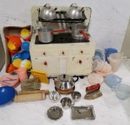 A mid 20th century tin plate  child's toy cooker, meths operated, with pans and tea kettles;