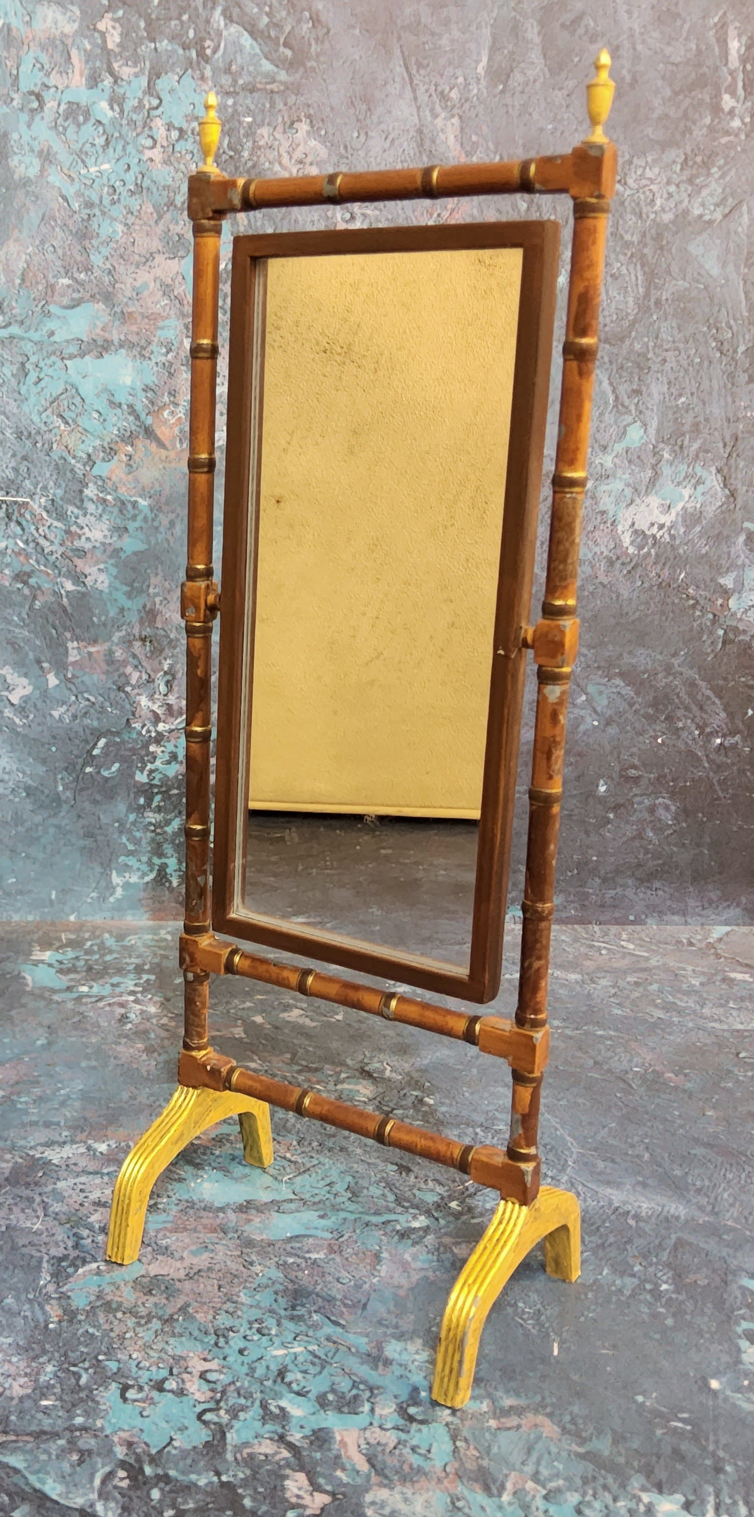 An early 20th century brass doll's house cheval mirror, faux bamboo frame, 25cm high, c.1910