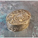 A 19th century Dutch silver oval box, embossed with tavern scene, the sides with scrolls, 2.75cn