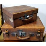 A mid 20th century rectangular leather suitcase, 57cm wide, 44cm deep;  another, smaller, 43cm wide,