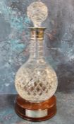 A hobnail cut globular decanter, silver collar, prismatic ball stopper, mahogany base, 33cm high,