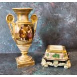 A French porcelain two handled pedestal ovoid vase, in the Empire taste, decorated with medieval