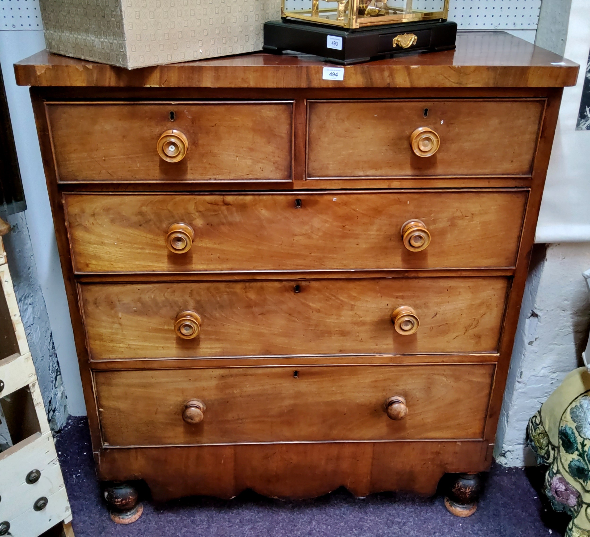 An early Victorian mahogany chest, of two above three graduated drawers, turned fruitwood handles