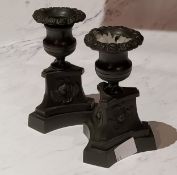 A pair of Regency bronze boudoir candlesticks, campana shaped sconces, triform bases, 11.5cm high,
