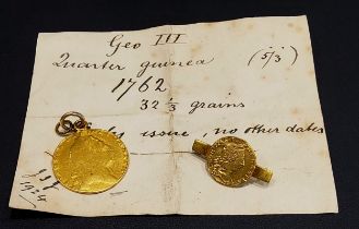 A George III Spade Guinea, later mount and a George III quarter Guinea, later yellow metal mount (2)