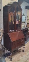 An early 20th century Queen Anne style bureau bookcase