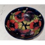 A Moorcroft Pansy pattern circular bowl,  tubed lined with  flowerheads, on a cobalt blue ground,